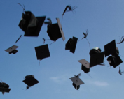 Graduation caps tossed up into the sky